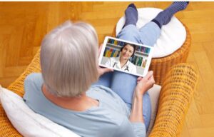 A woman consults with her doctor using telemedicine. Telehealth stocks are a strong bet to do well amid coronavirus.