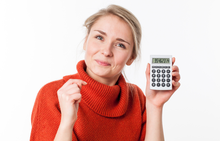 a lady holding a simple ROI calculator