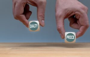 Cheap tech stocks means you are getting good value for the price. Two hands hold dice that say quality and price.